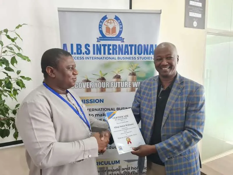 Participant receiving a certificate of attendance at an AIBS training