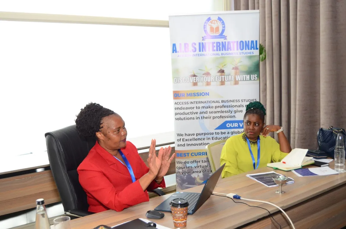 Two facilitators in discussion during an AIBS training session